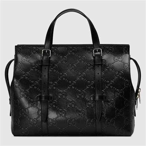 gucci black embossed bag.